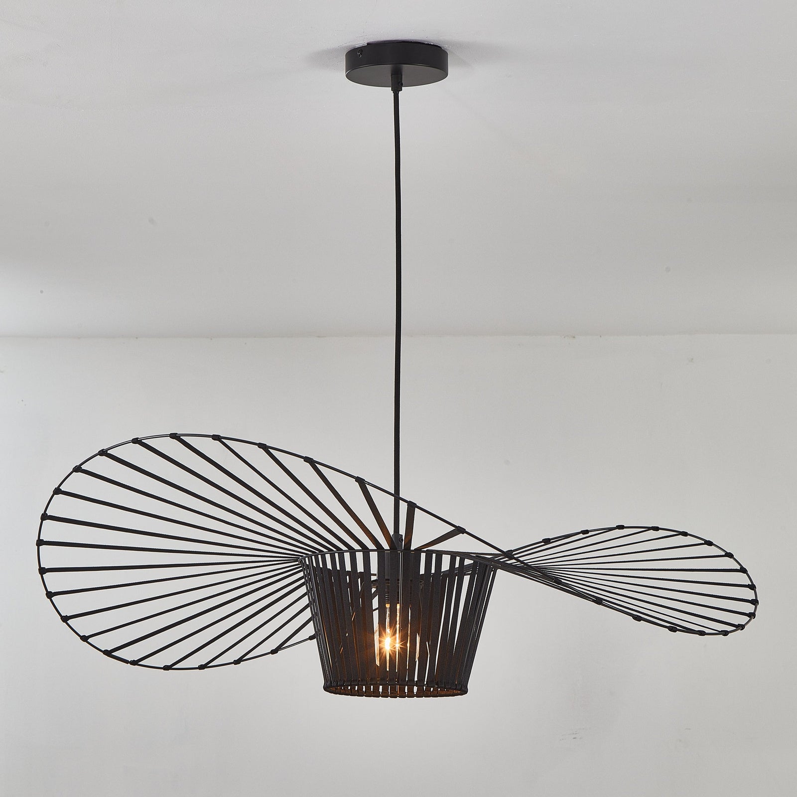 Modern black pendant light fixture on a white ceiling