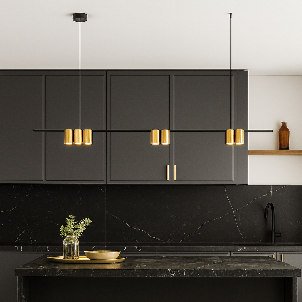Modern black and gold bar pendant light hanging over a luxury kitchen island with black cabinetry and marble finishes.