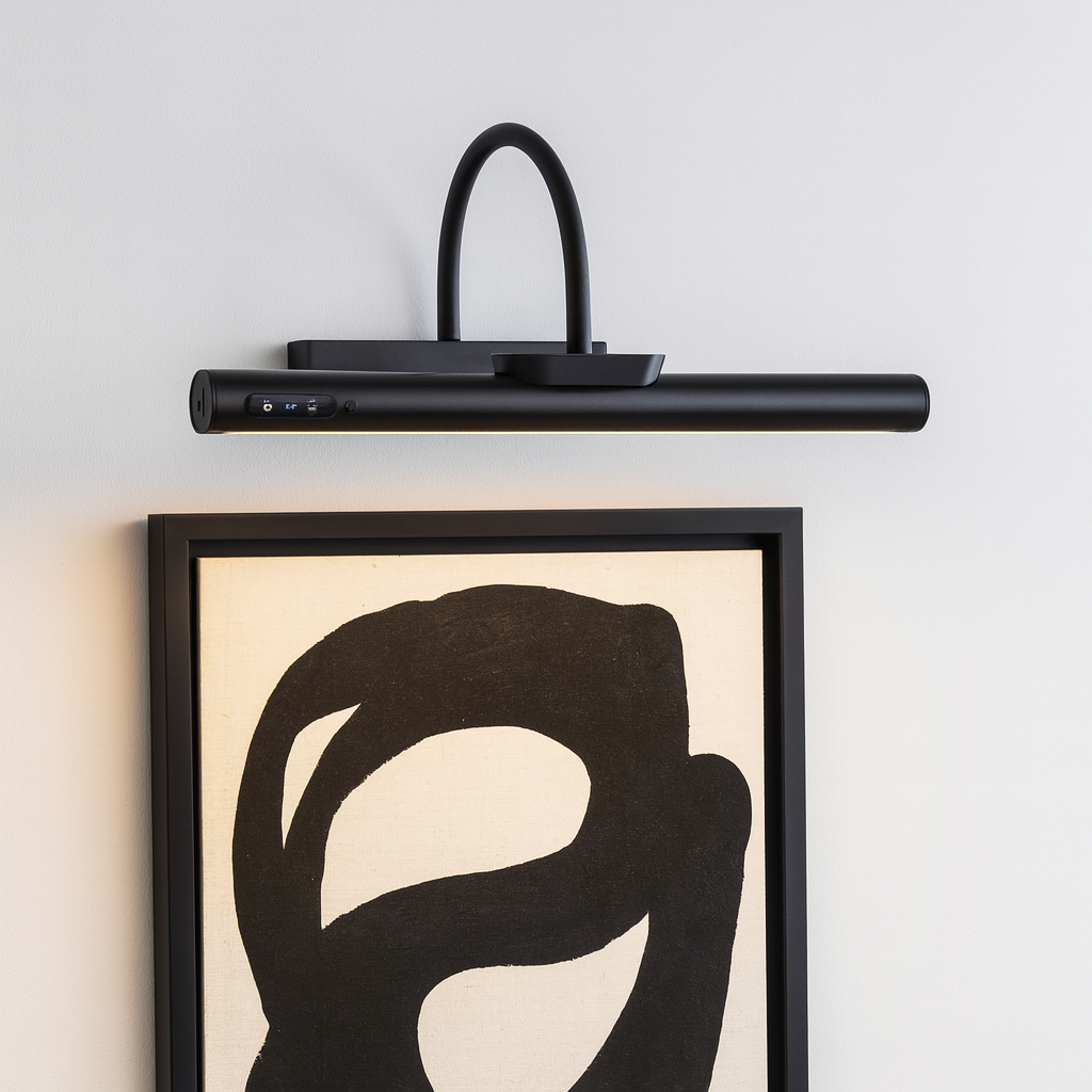 Black picture light 35cm wide mounted above a modern abstract black and white artwork on a white wall