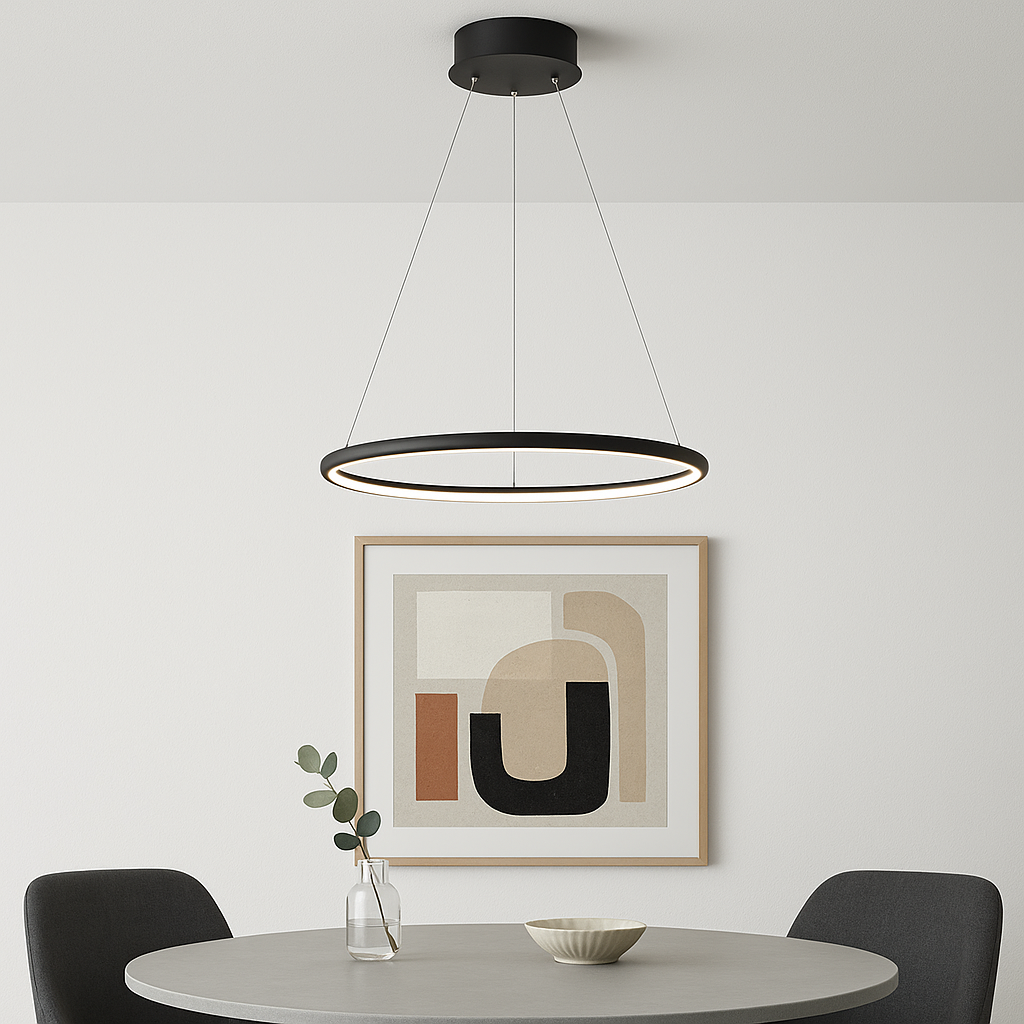 Bruges modern round pendant light in black, hanging above a dining table with abstract artwork in a contemporary dining room.