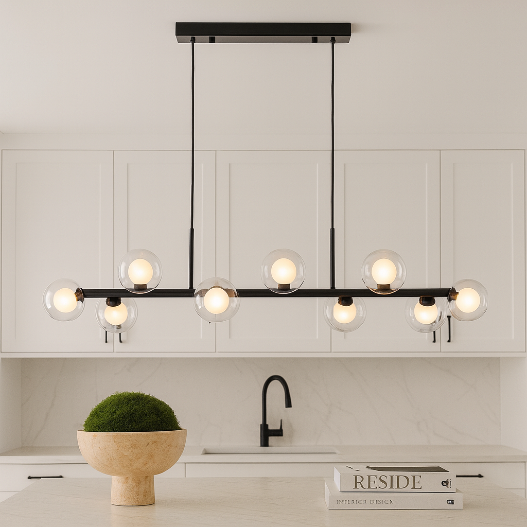 Eden black linear pendant bar light over white kitchen island.