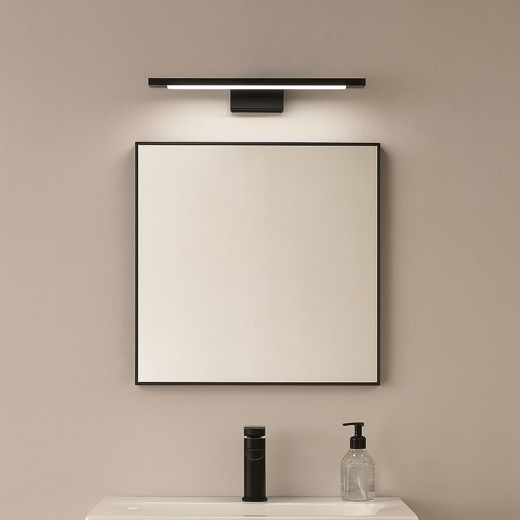 Modern black wall light mounted above a bathroom mirror with minimalist sink styling